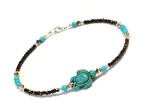 Beaded sea turtle anklet in the colors of turquoise and bronze