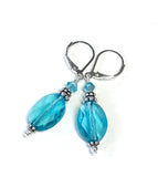 Oval crystal earrings in the color of light turquoise and sterling silver leverbacks